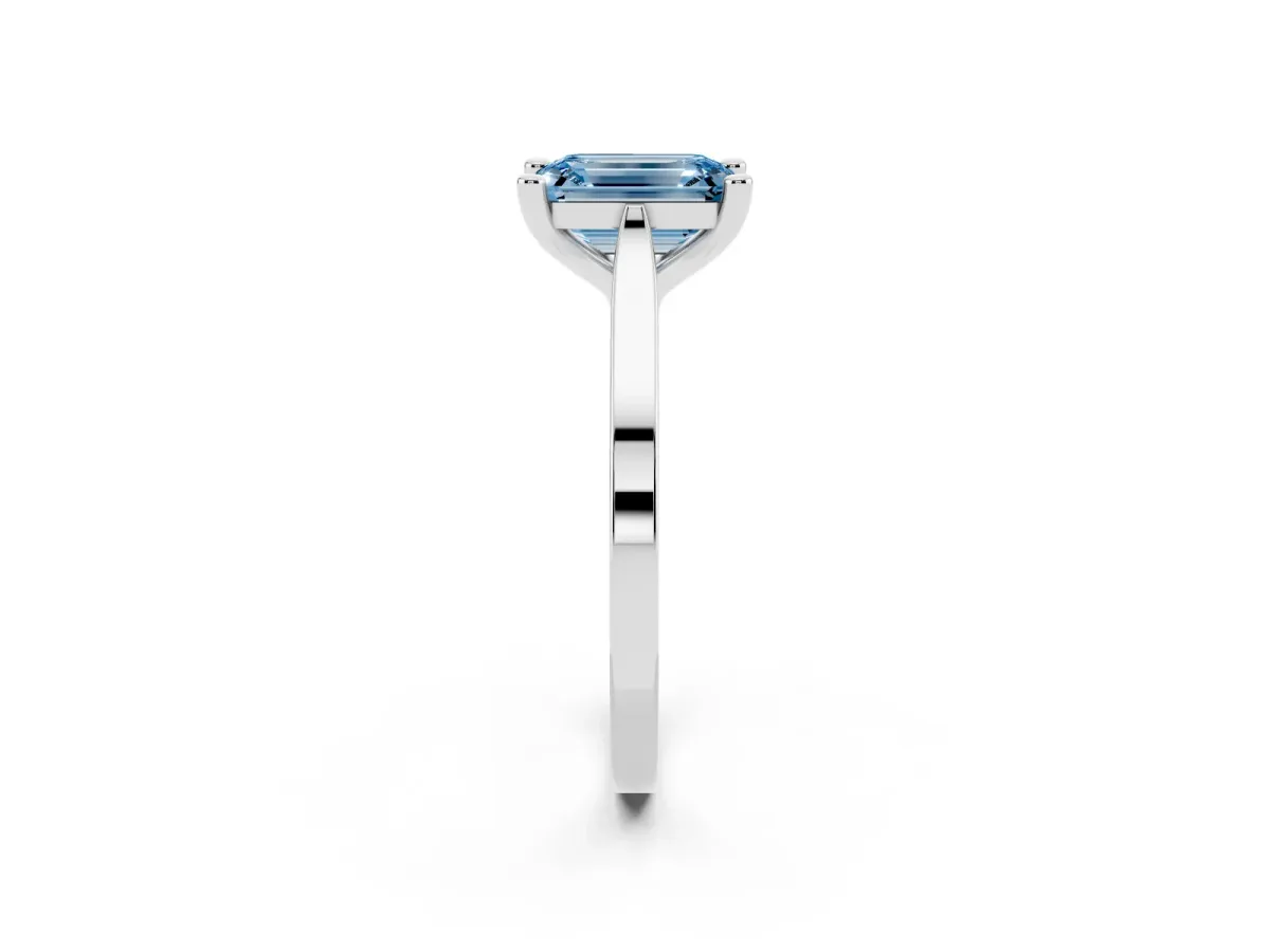 Fancy Blue Emerald Cut Solitaire Diamond Ring with Four-Prong Setting and Tapered Band Silver