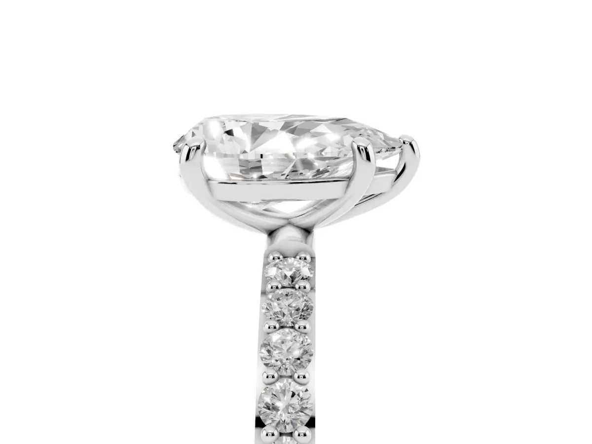 Pear Cut Diamond Solitaire Ring with Round Pavé Band and Prong Setting Silver