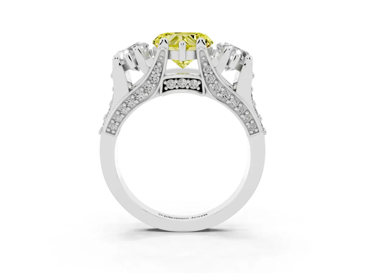 Fancy Yellow Heart Cut Diamond Three-Stone Ring with Channel Set Band and Four-Prong Setting White gold