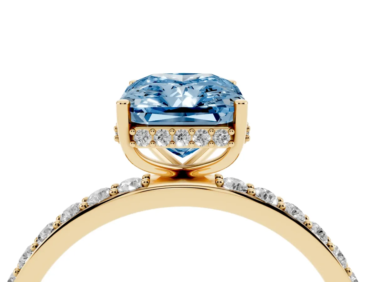 Fancy Blue Radiant Cut Diamond Solitaire Ring with Pavé Band and Hidden Halo Yellow gold