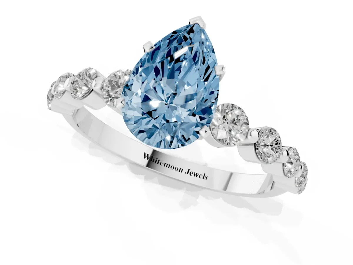 Fancy Blue Pear Cut Solitaire Diamond Ring with Pave Band and Four-Prong Setting Silver