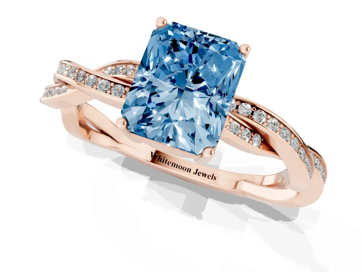 Fancy Blue Radiant Cut Solitaire Twisted Pave Diamond Ring with Four-Prong Setting Rose gold