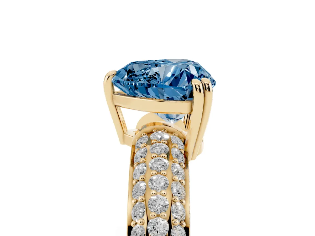 Fancy Blue Heart Cut Diamond Solitaire Ring with Multi-Row Round Pavé Band and Prong Setting Yellow gold