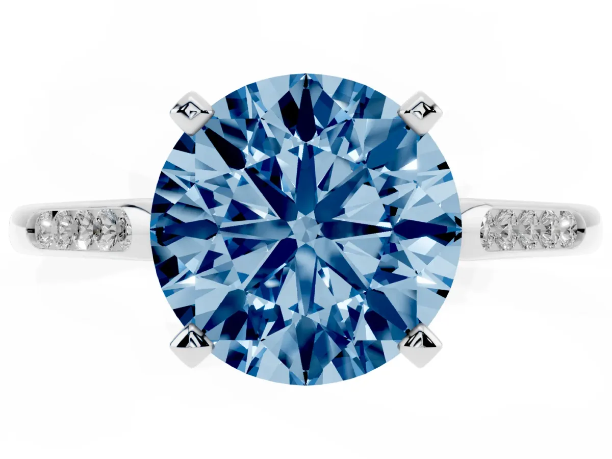 Fancy Blue Round Cut Diamond Solitaire Ring with Channel Set Round Band and Prong Setting Silver