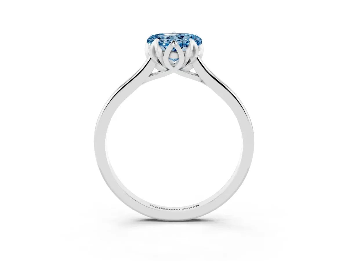 Fancy Blue Heart Cut Diamond Solitaire Ring with Flower Prong Setting and Classic Band Silver