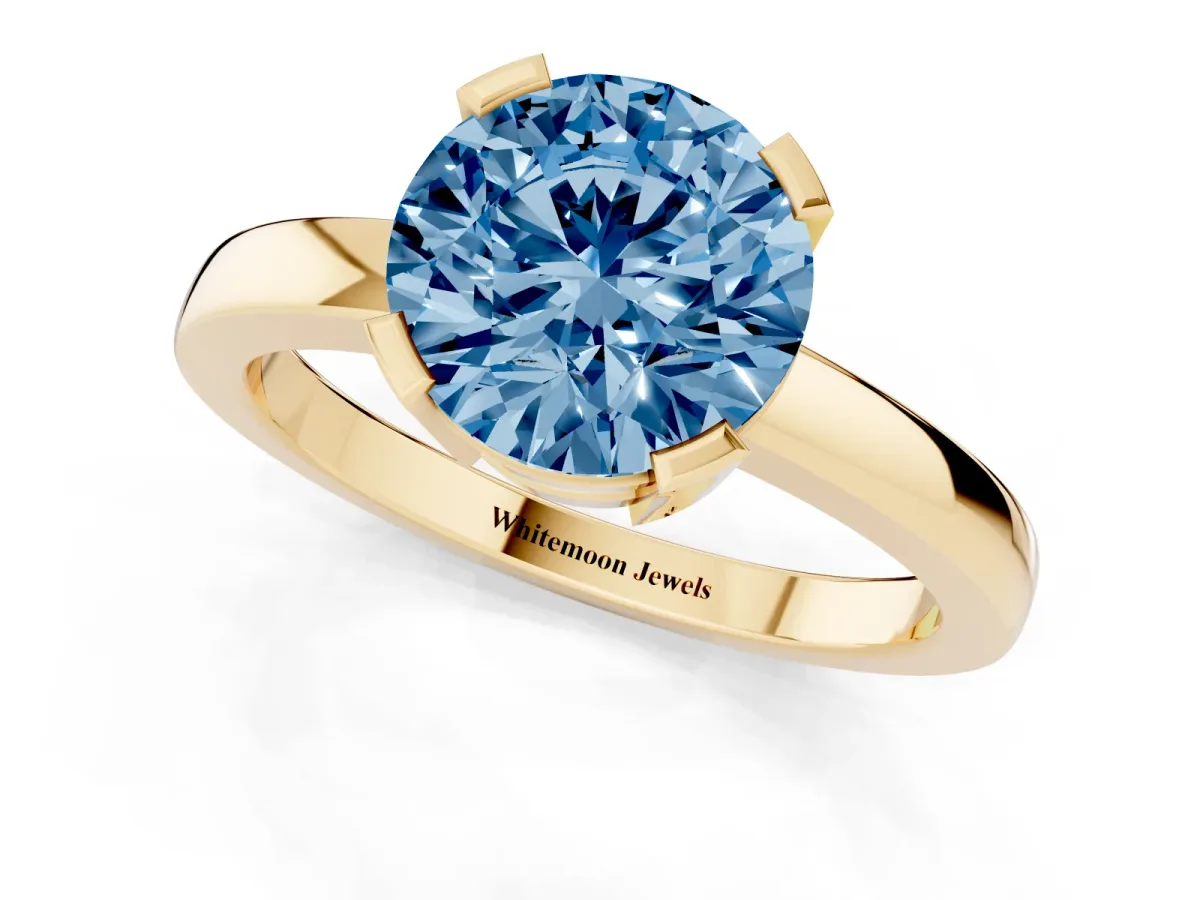 Fancy Blue Round Cut Cut Solitaire Ring with Four-Prong Setting and Classic Band Yellow gold