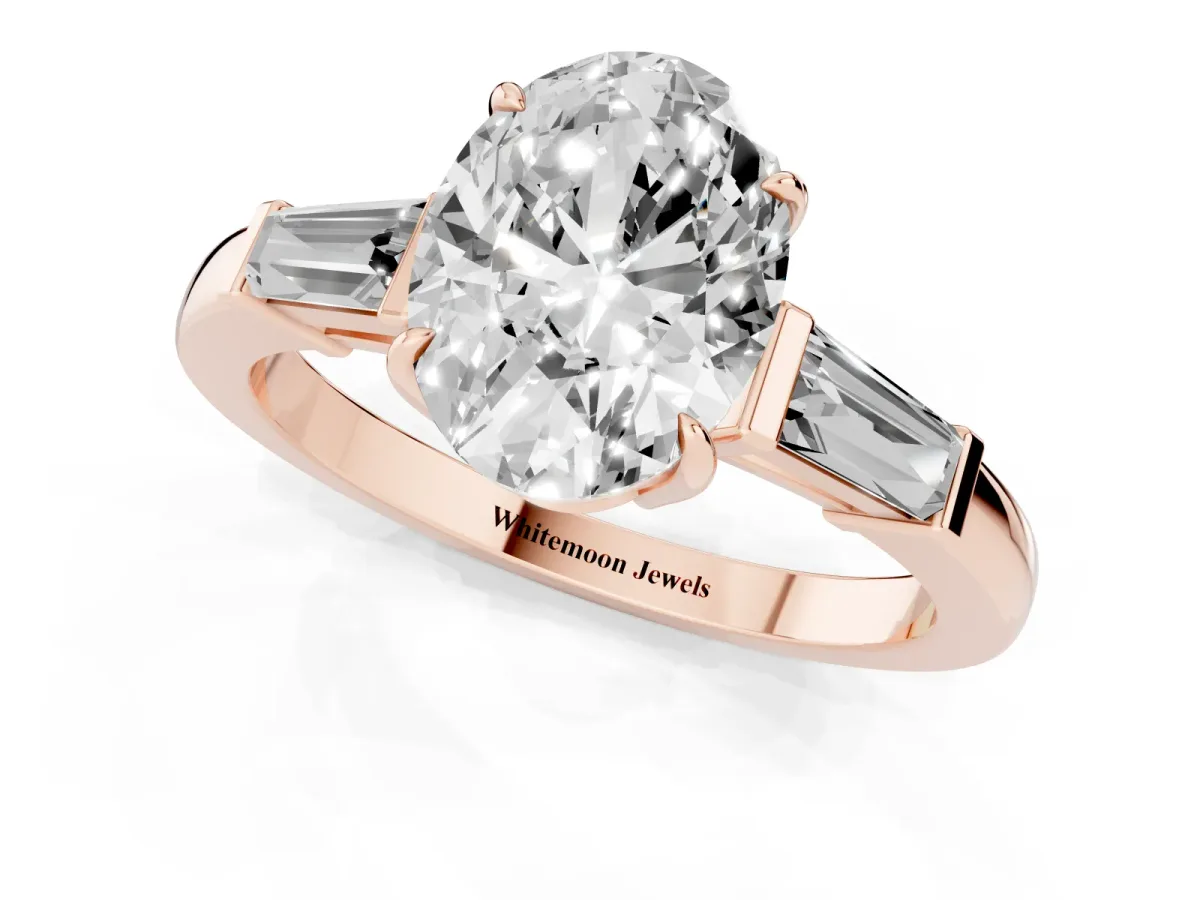Oval Cut Diamond Three-Stone Ring with Tapered Baguette Side Stones and Prong Setting Rose gold