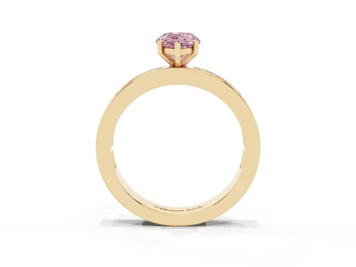 Fancy Pink Pear Cut Solitaire Diamond Ring with Channel-Set Baguette Band and Four-Prong Setting Yellow gold