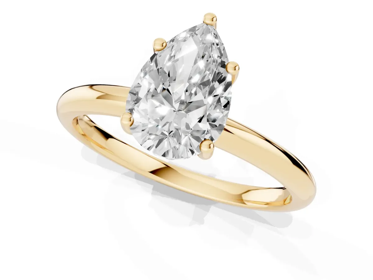Pear Cut Cut Solitaire Engagement Ring with Four-Prong Setting and Classic Band Yellow gold