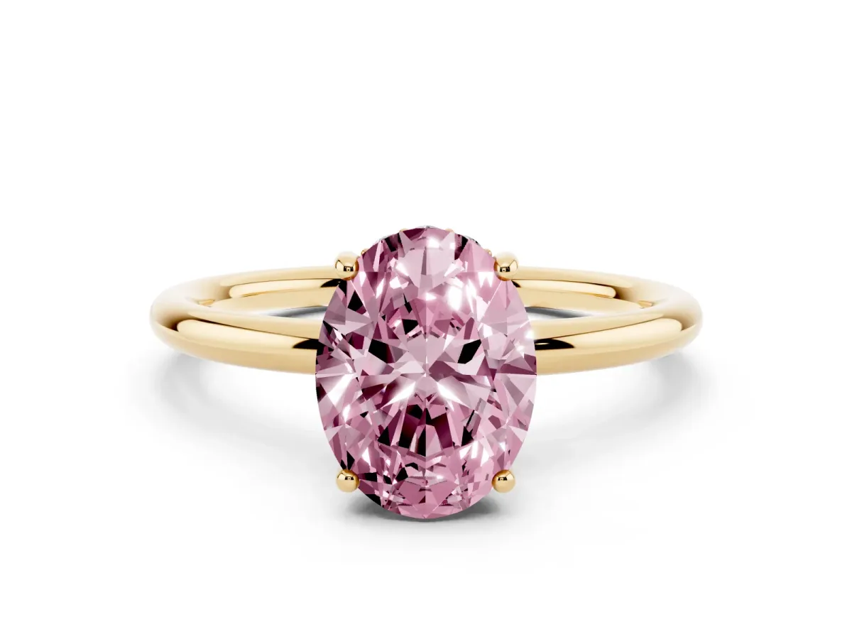 Fancy Pink Oval Cut Solitaire Diamond Ring with a Classic Band and Four-Prong Setting Yellow gold