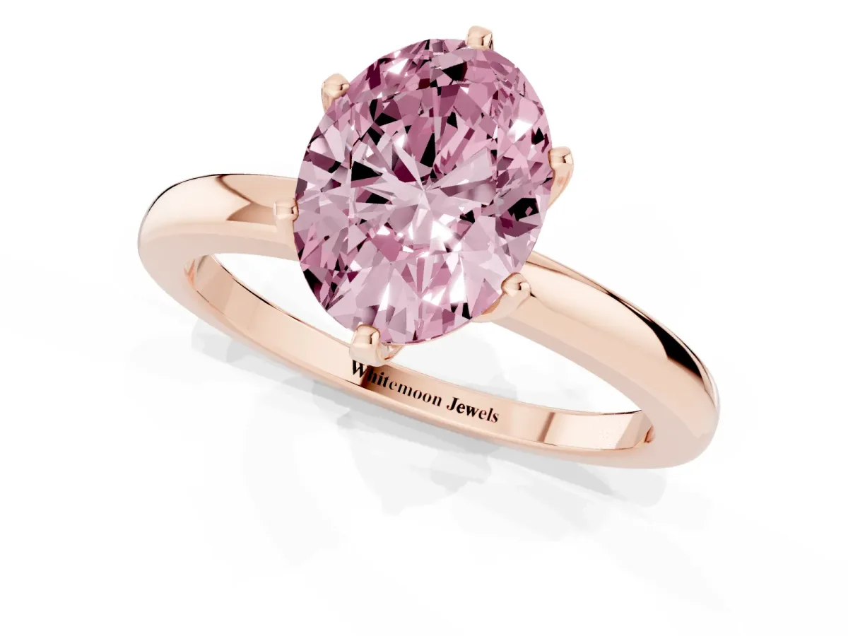 Fancy Pink Oval Cut Solitaire Diamond Ring with Six-Prong Setting on a Classic Band Rose gold