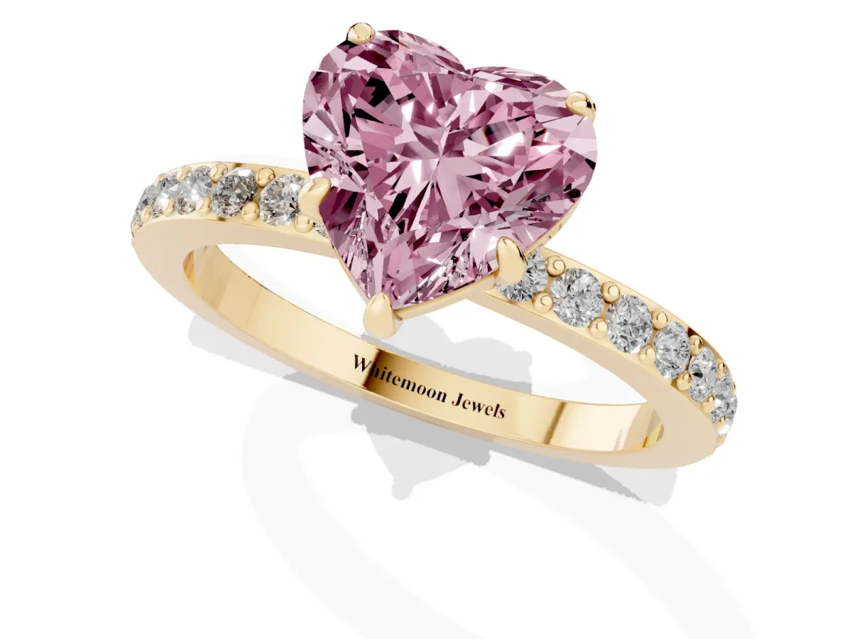 Fancy Pink Heart Cut Diamond Pavé Engagement Ring with Round Accents and Prong Setting Yellow gold