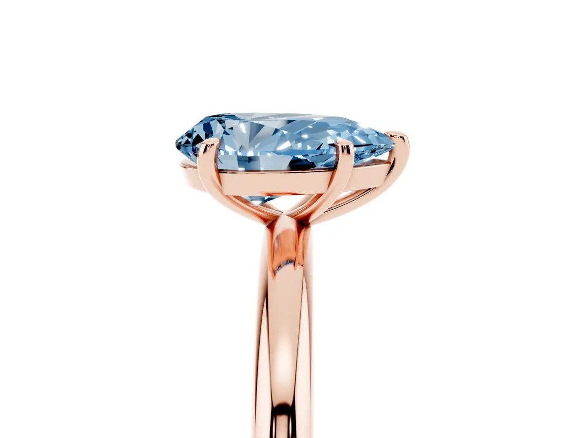 Fancy Blue Pear Cut Solitaire Diamond Ring with Four-Prong Setting on a Plain Band Rose gold