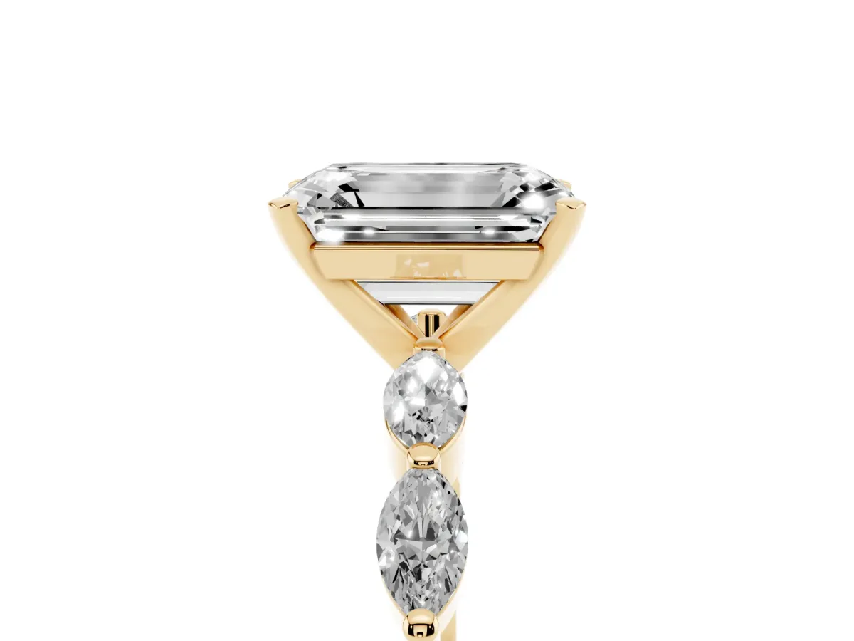 Emerald Cut Diamond Ring with Marquise Side Stones and Prong Setting Yellow gold