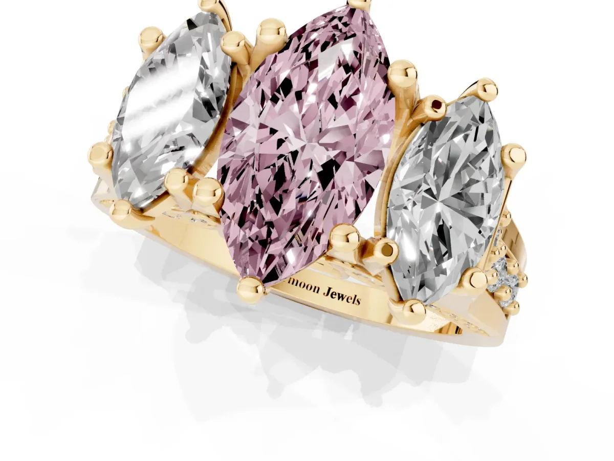 Fancy Pink Marquise Cut Diamond Three-Stone Ring with Channel Set Band and Four-Prong Setting Yellow gold