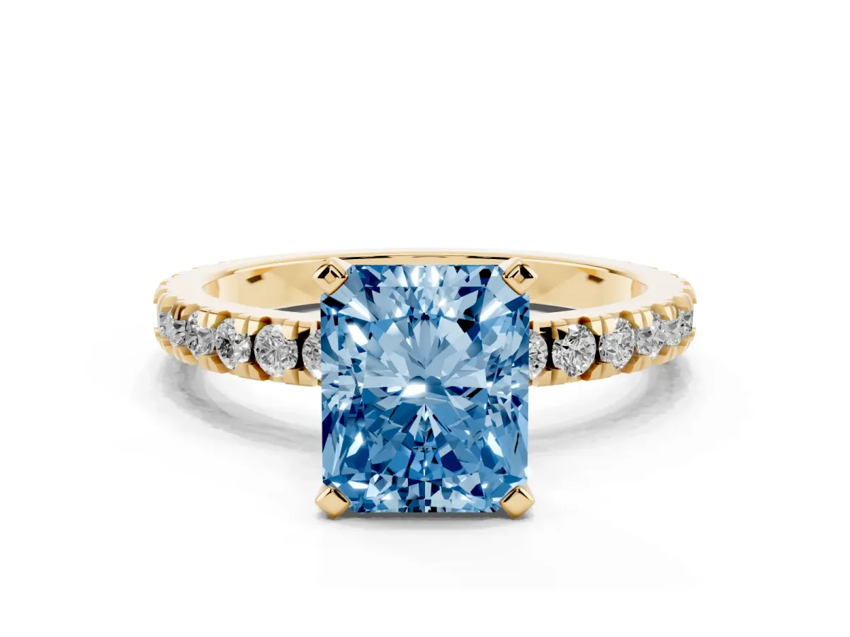 Fancy Blue Radiant Cut Diamond Pavé Band Solitaire with Four-Prong Setting Yellow gold