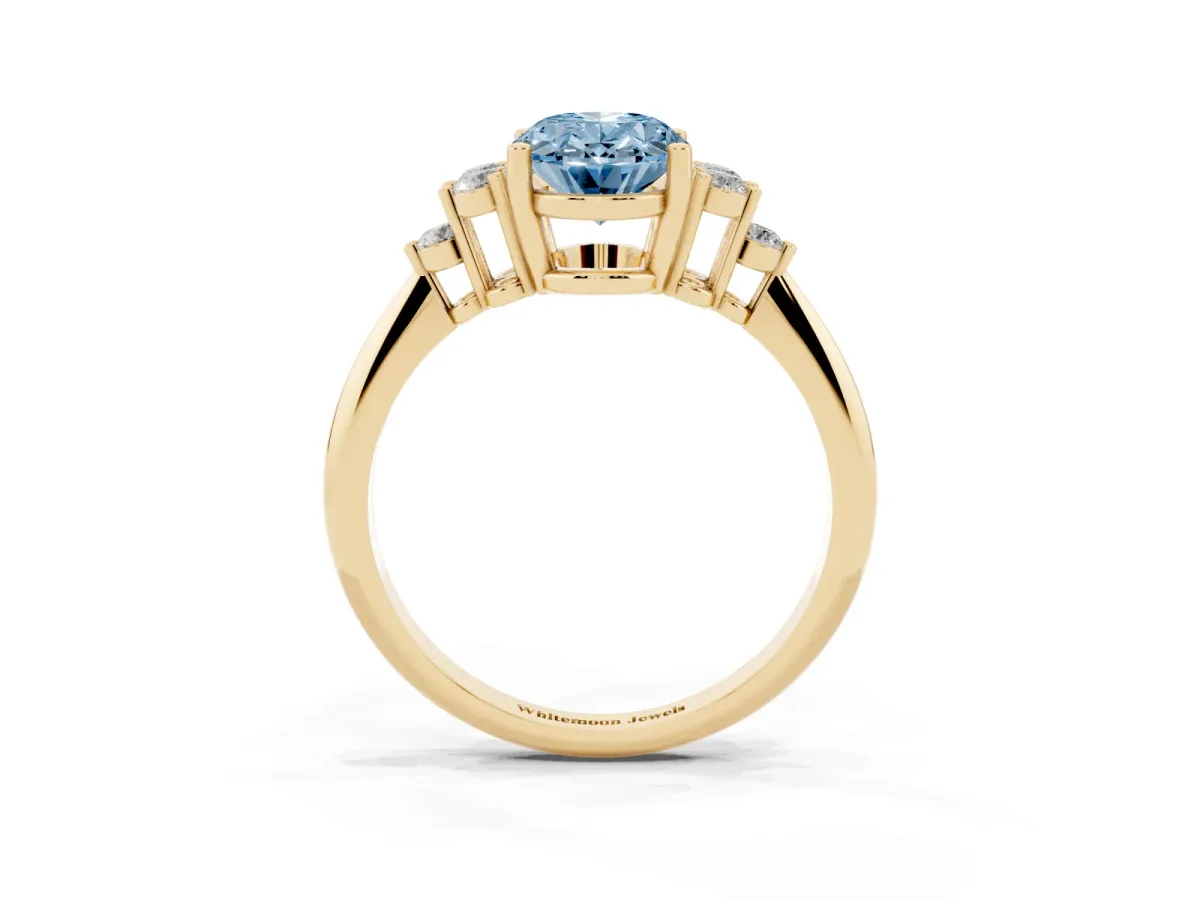 Fancy Blue Oval Cut Cut Diamond Cluster Ring with Solitaire Band and Four-Prong Setting Yellow gold