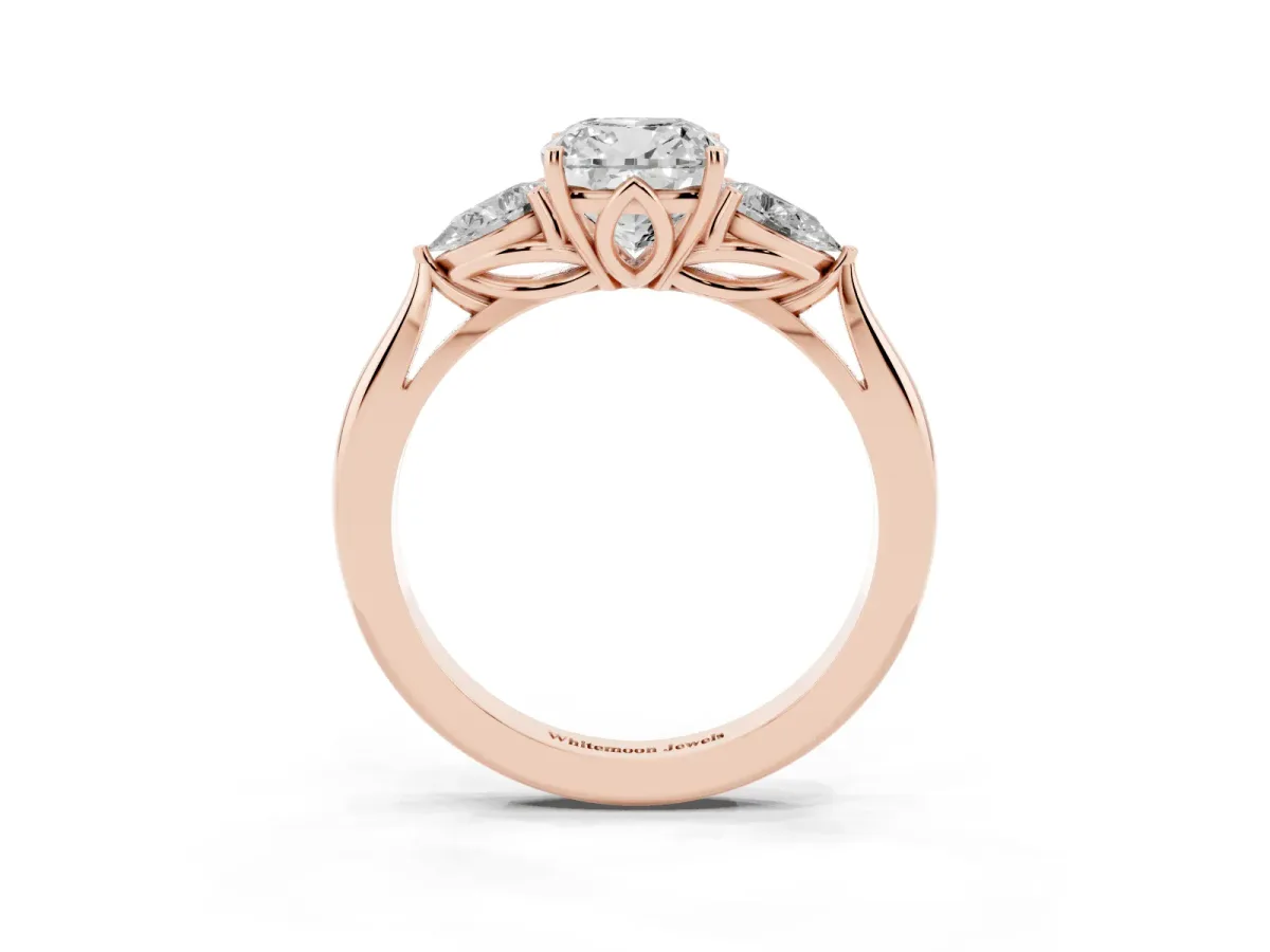 Three-Stone Cushion Cut Diamond Ring with Pear Side Stones in Four-Prong Setting Rose gold