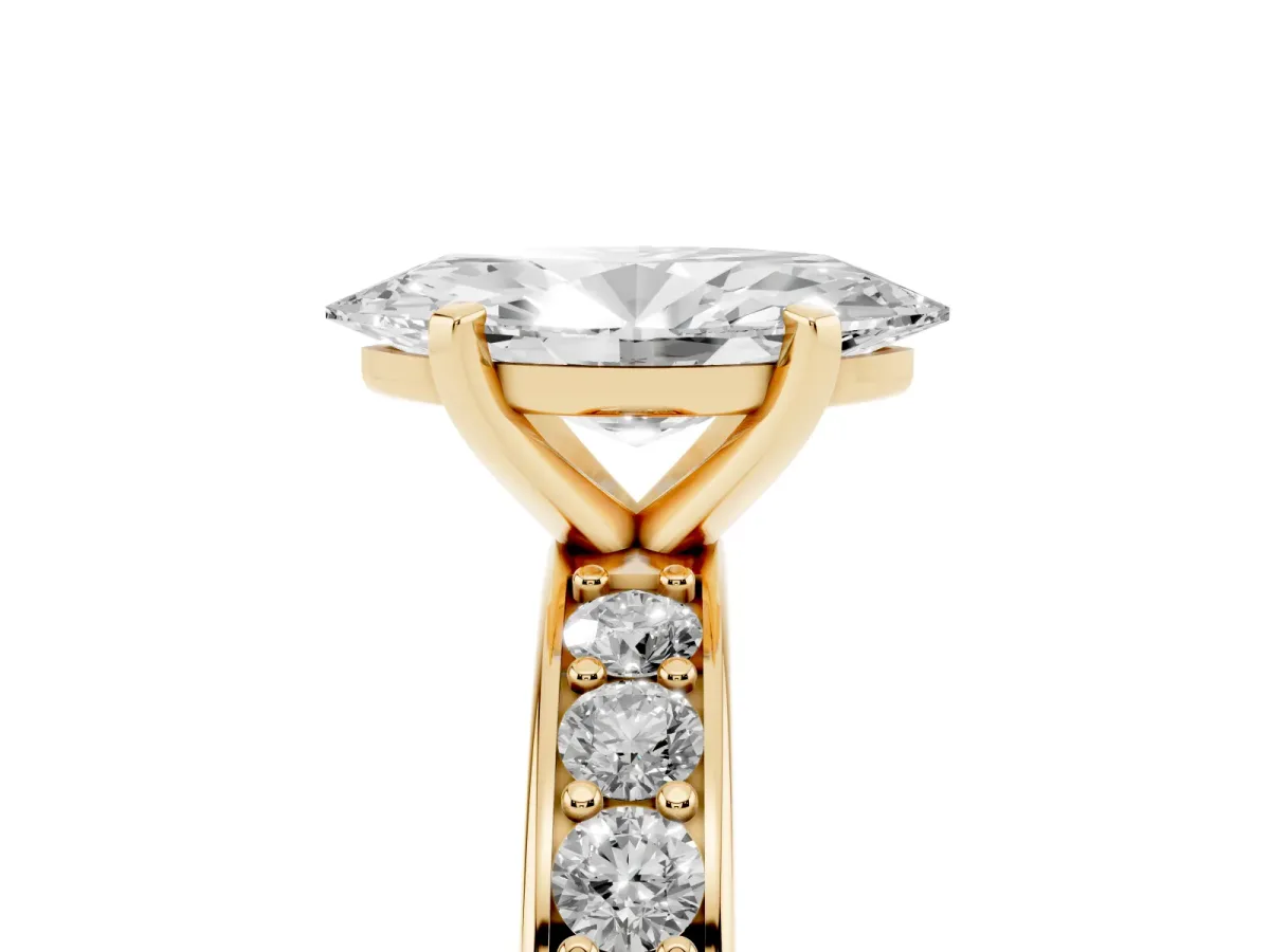 Marquise Cut Diamond Engagement Ring with Channel Set Round Band and Prong Setting Yellow gold