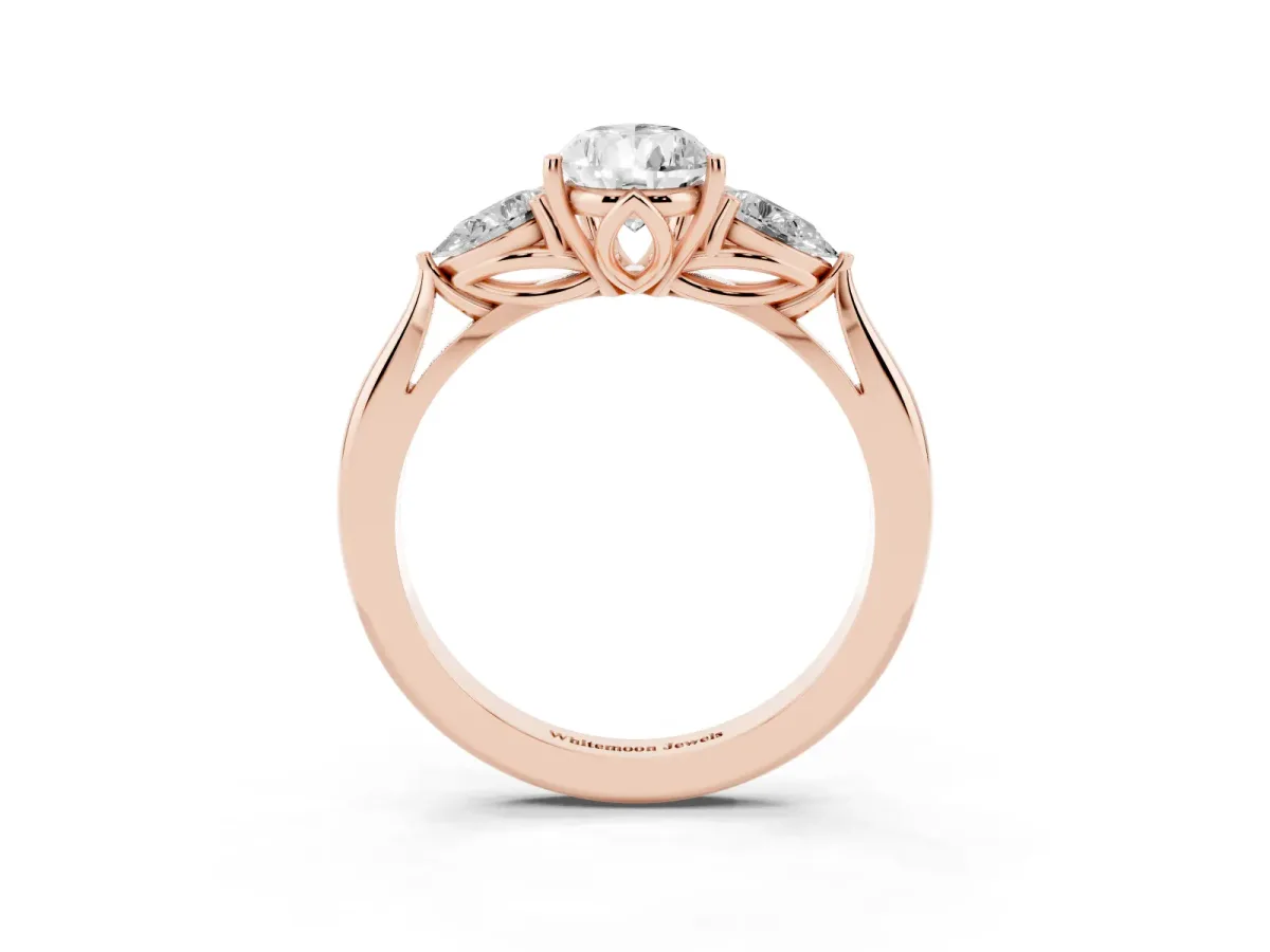 Three-Stone Pear Cut Diamond Ring with Pear Side Stones in Four-Prong Setting Rose gold