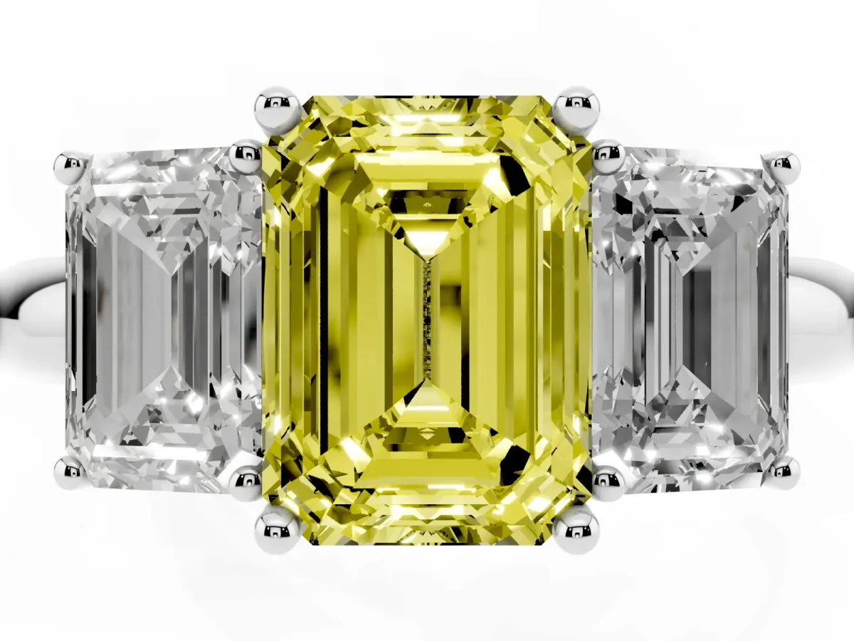 Fancy Yellow Three-Stone Emerald Cut Cut Diamond Engagement Ring with Prong Setting on a White Gold Band Platinum