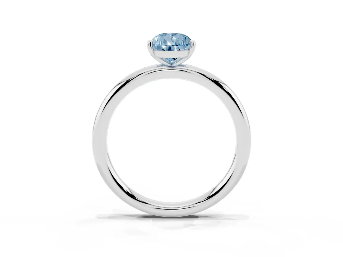 Fancy Blue Pear Cut Solitaire Diamond Ring with Four-Prong Setting on a Plain Band Silver
