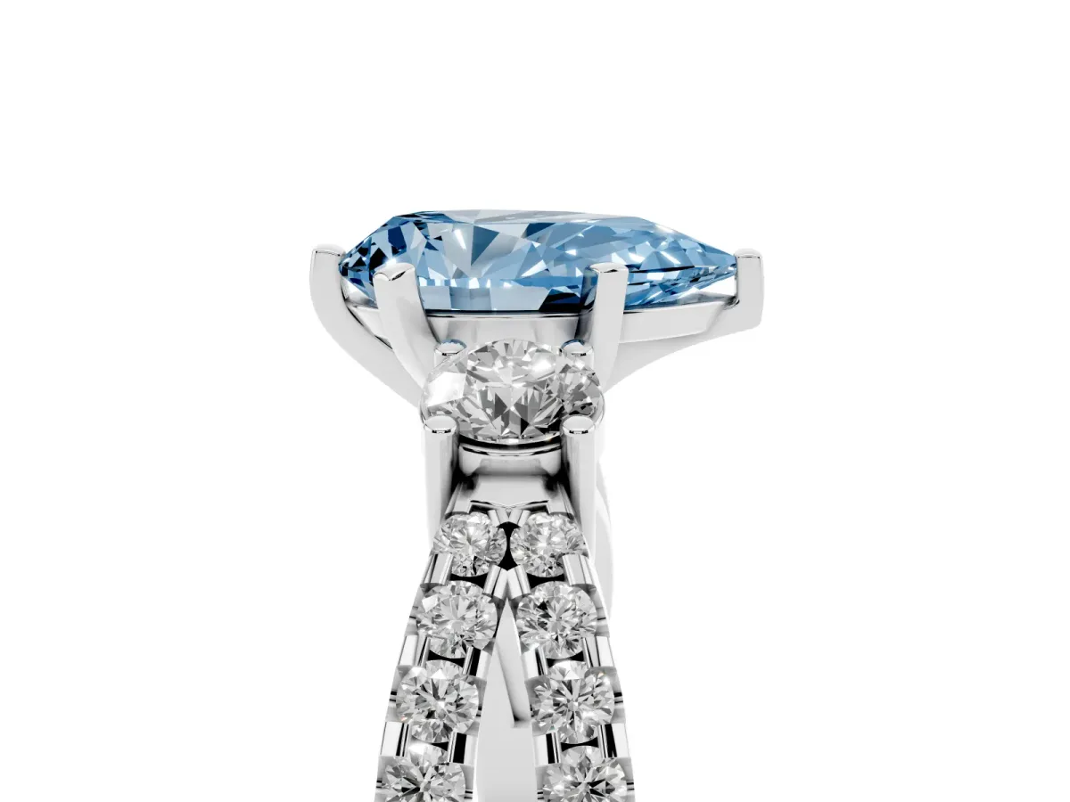 Fancy Blue Pear Cut Diamond Three-Stone Ring with Pavé Split Shank and Four-Prong Setting Silver