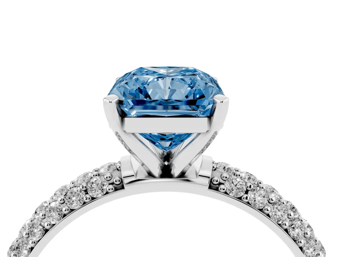 Fancy Blue Radiant Cut Diamond Solitaire Ring with Prong Setting and Pavé Band Silver