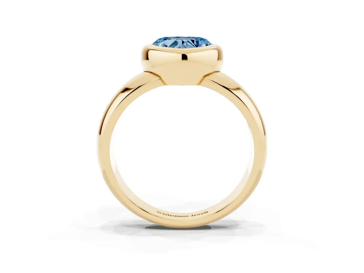 Fancy Blue Bezel Set Heart Cut Solitaire Ring with Wide Band Yellow gold