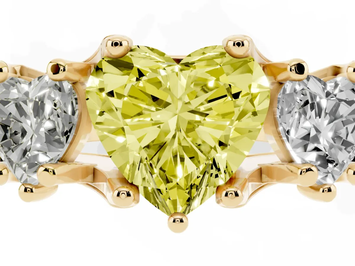 Fancy Yellow Heart Cut Diamond Three-Stone Ring with Channel Set Band and Four-Prong Setting Yellow gold
