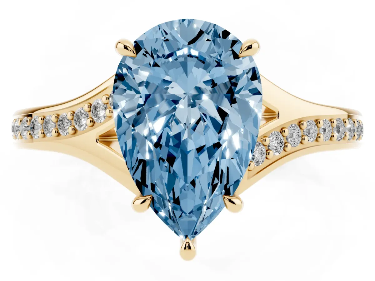 Fancy Blue Pear Cut Diamond Solitaire Ring with Pavé Band and Prong Setting Yellow gold