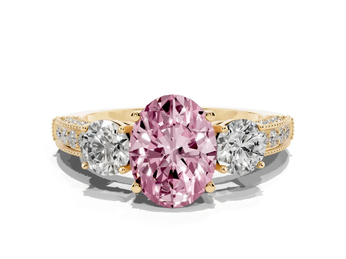 Fancy Pink Oval Cut Three-Stone Diamond Ring with Pavé Band and Four-Prong Setting Yellow gold