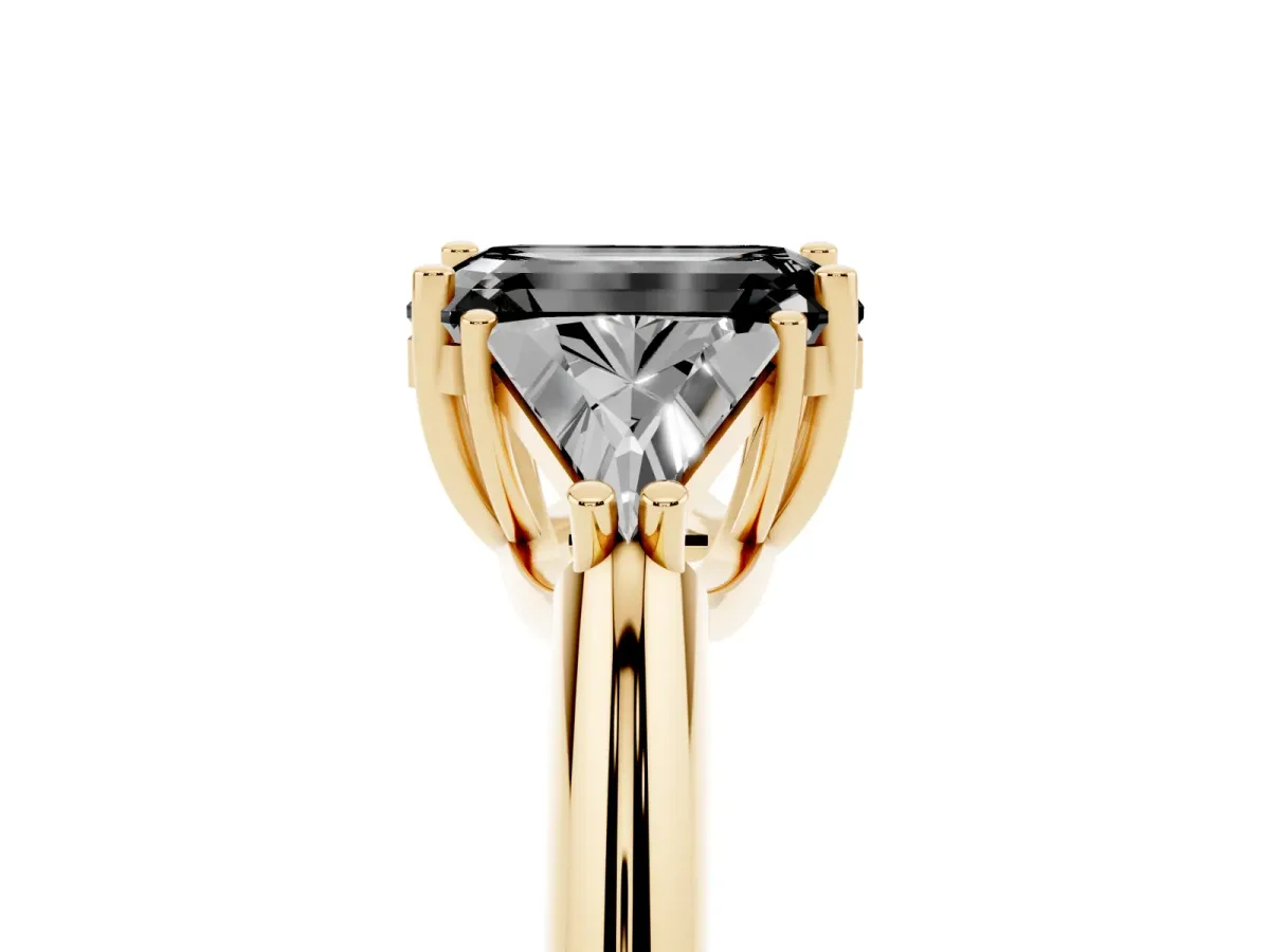 Fancy Black Three-Stone Emerald Cut Diamond Engagement Ring with Trillion Side Stones and Prong Setting Yellow gold