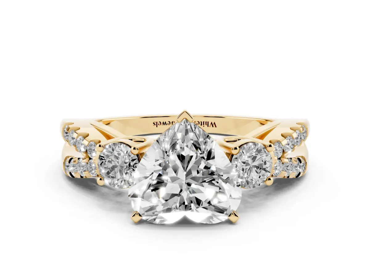 Heart Cut Diamond Three-Stone Ring with Pavé Split Shank and Four-Prong Setting Yellow gold