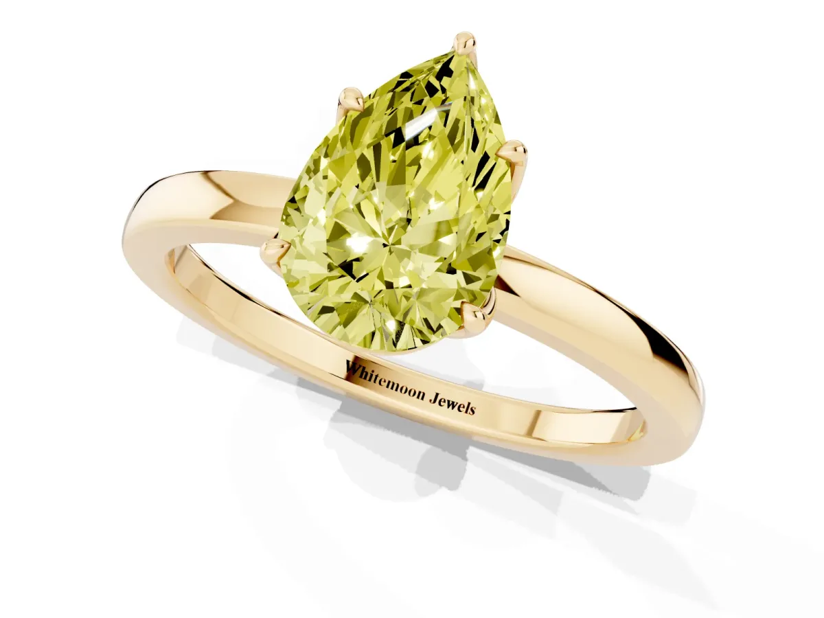 Fancy Yellow Pear Cut Diamond Solitaire Ring with Thin Band and Prong Setting Yellow gold