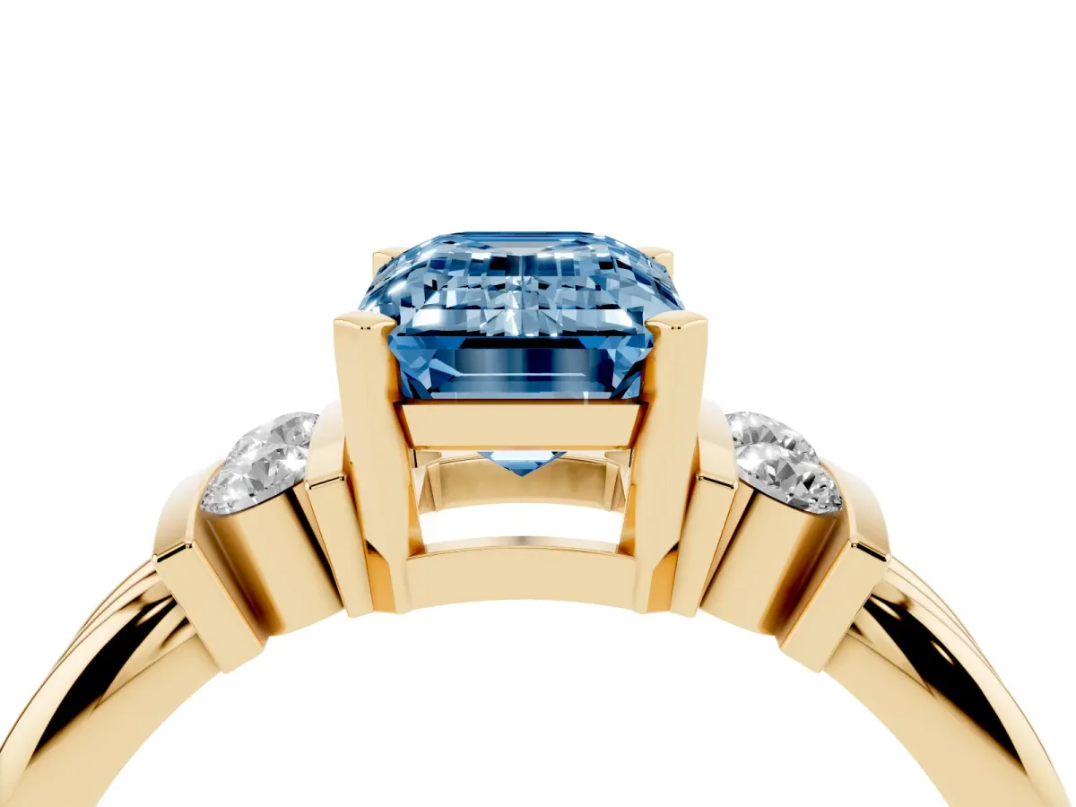 Fancy Blue Emerald Cut Cut Three-Stone Channel Set Ring with Bar Prongs Yellow gold