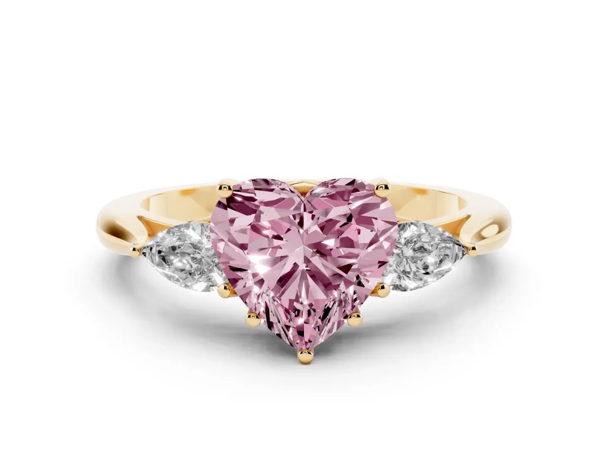 Fancy Pink Heart Cut Diamond Three-Stone Ring with Pear Side Stones and Prong Setting Yellow gold