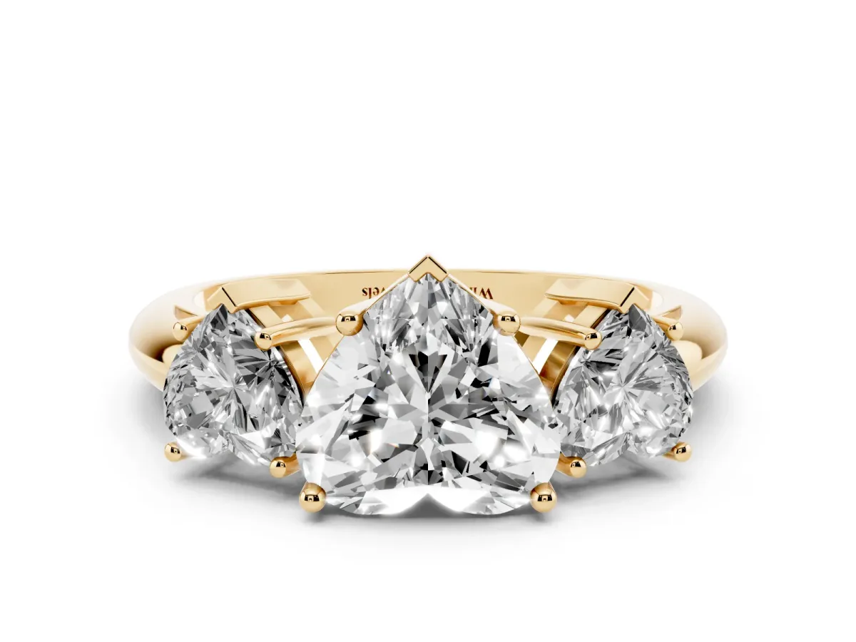 Three-Stone Heart Cut Cut Diamond Engagement Ring with Prong Setting on a White Gold Band Yellow gold