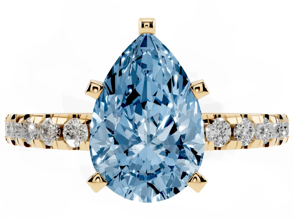 Fancy Blue Pear Cut Diamond Solitaire Ring with Round Pavé Band and Four-Prong Setting Yellow gold