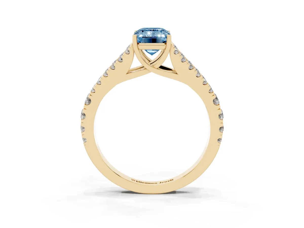 Fancy Blue Emerald Cut Diamond Split Shank Engagement Ring with Round Pavé and Prong Setting Yellow gold