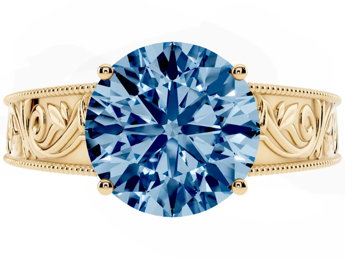 Fancy Blue Round Cut Diamond Solitaire Ring with Engraved Band and Four-Prong Setting Yellow gold