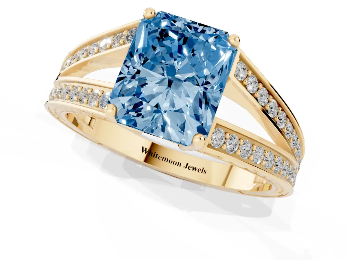 Fancy Blue Radiant Cut Diamond Split Shank Ring with Pavé Band and Four-Prong Setting Yellow gold
