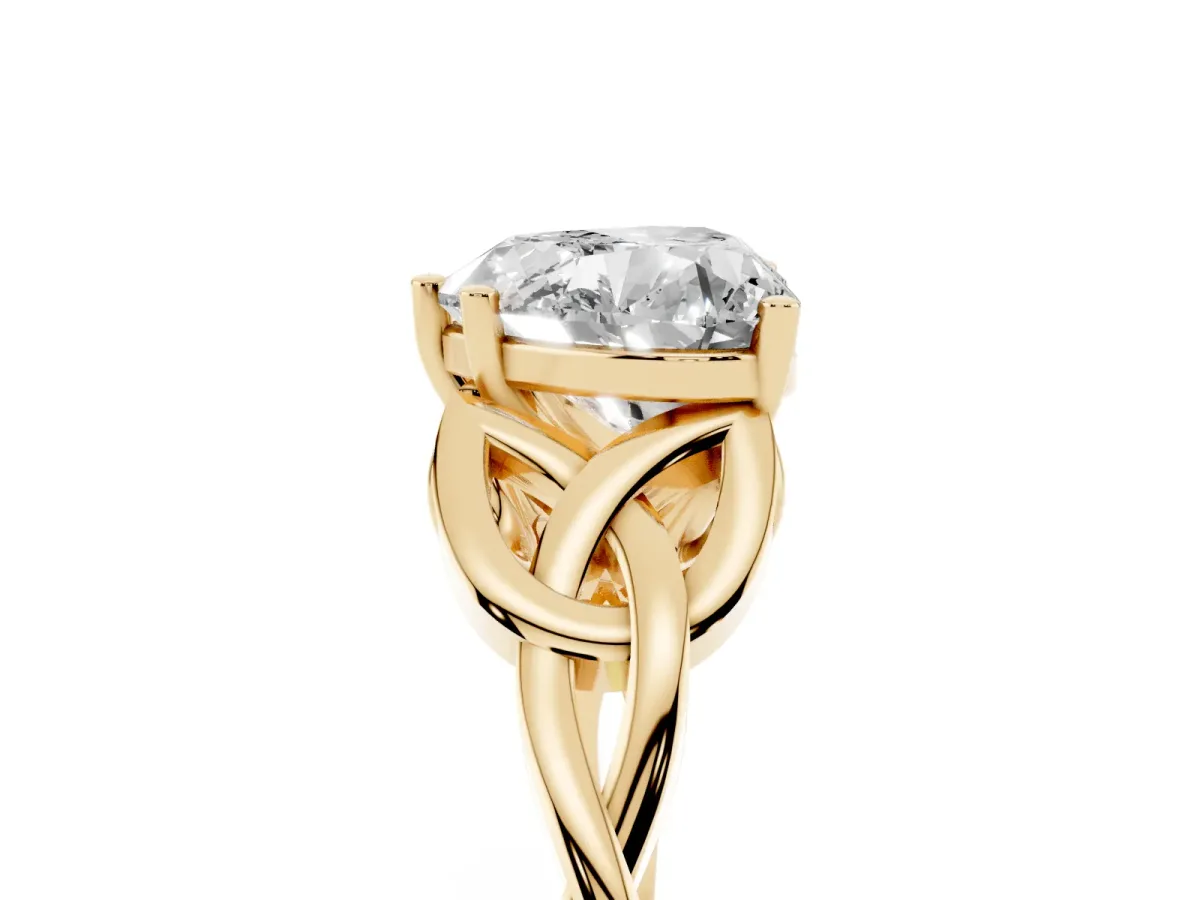 Heart Cut Diamond Solitaire Engagement Ring with Celtic Knot Band and Four-Prong Setting Yellow gold