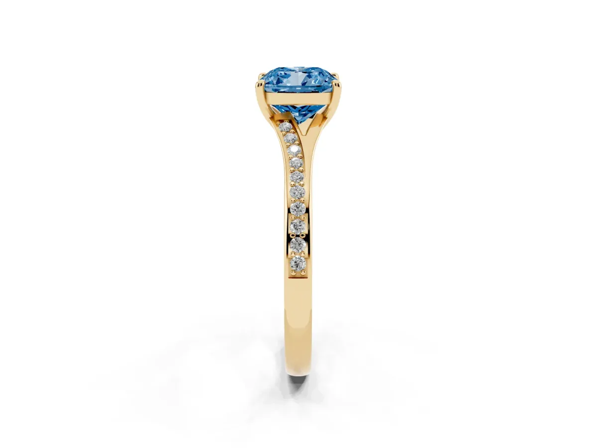 Fancy Blue Cushion Cut Diamond Solitaire Ring with Pavé Band and Prong Setting Yellow gold