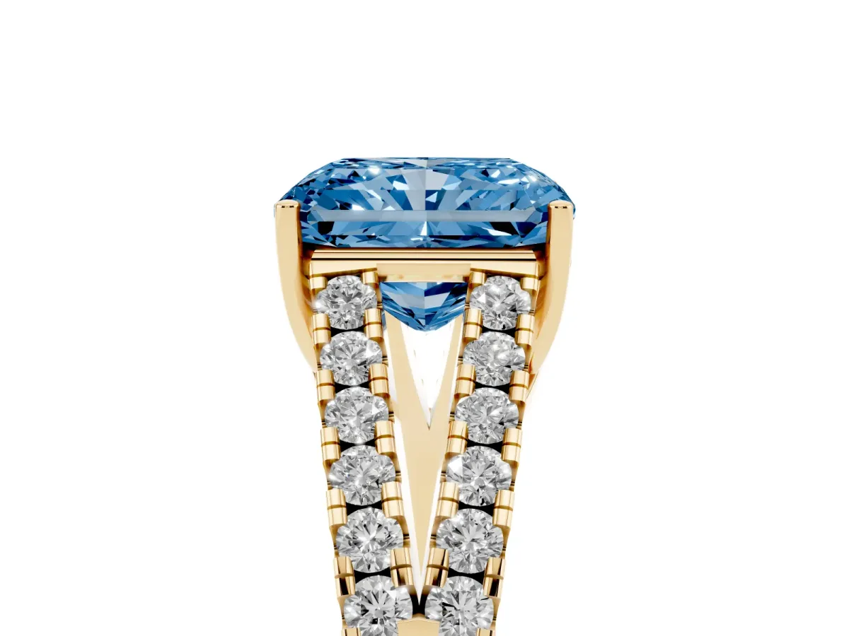 Fancy Blue Radiant Cut Diamond Split Shank Engagement Ring with Round Pavé and Prong Setting Yellow gold