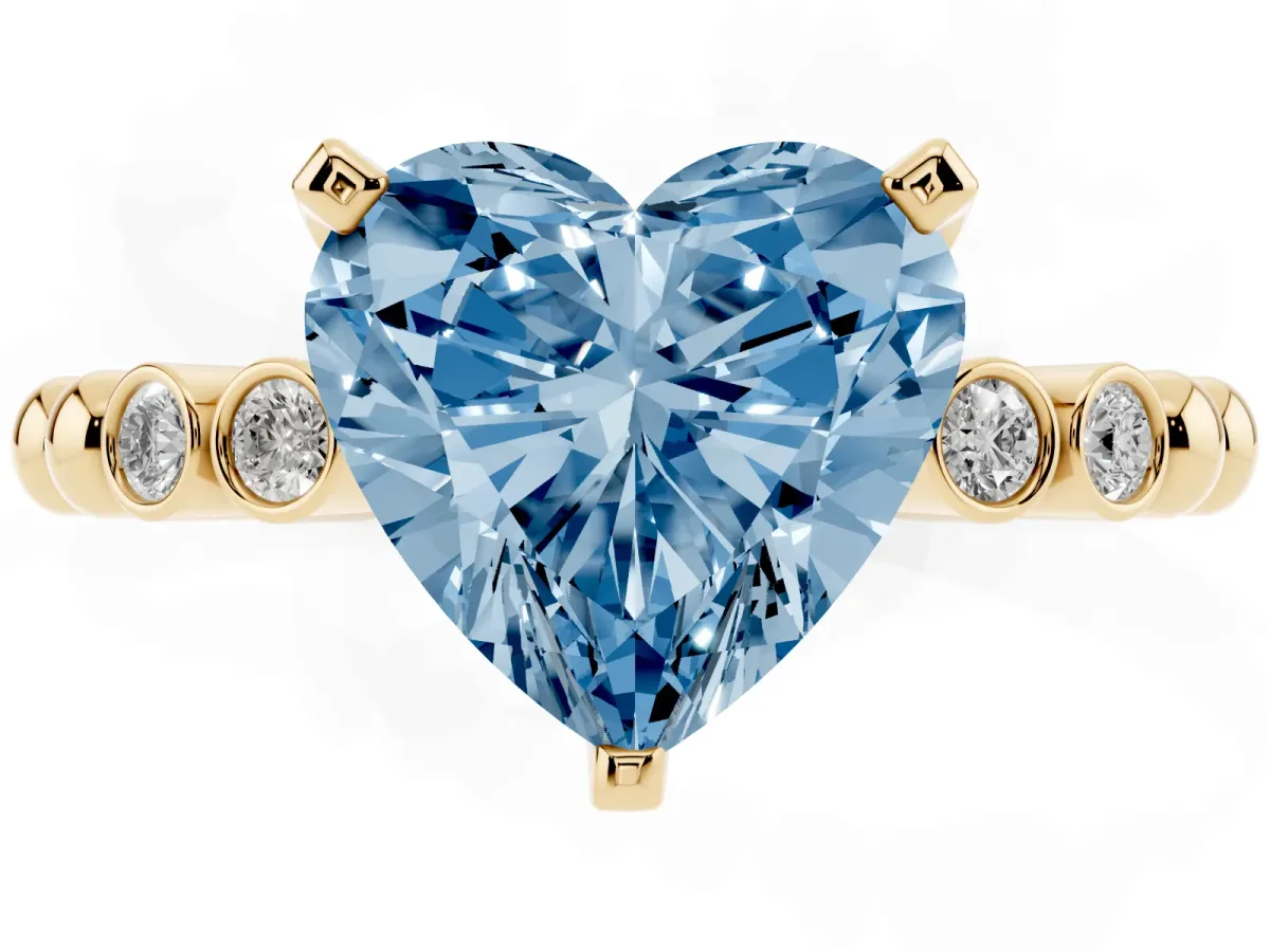 Fancy Blue Heart Cut Solitaire Bezel Accent Diamond Engagement Ring with Beaded Band and Four-Prong Setting Yellow gold