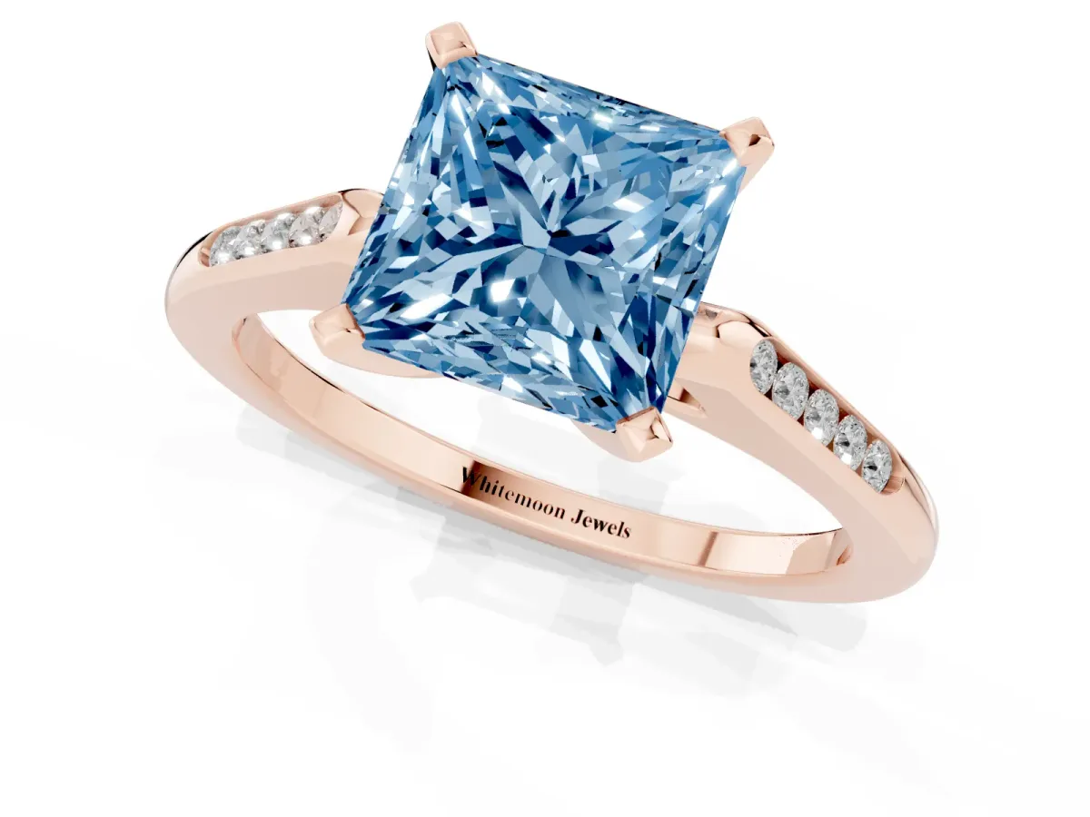 Fancy Blue Princess Cut Diamond Solitaire Ring with Channel Set Round Band and Prong Setting Rose gold