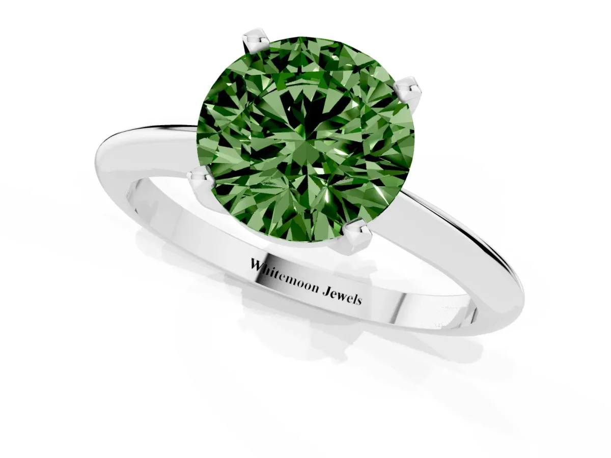 Fancy Green Round Cut Cut Solitaire Ring with Four-Prong Setting on a Classic Band Silver