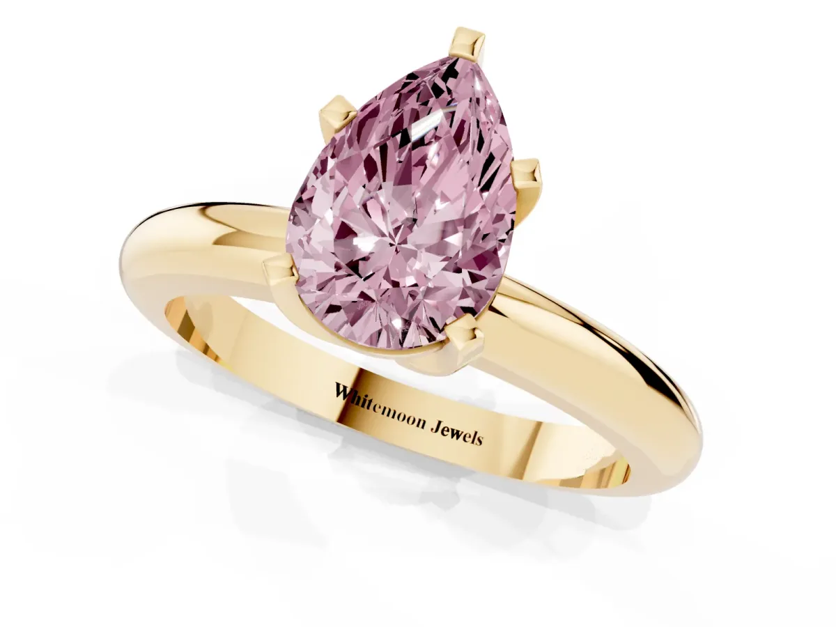 Fancy Pink Pear Cut Diamond Solitaire Engagement Ring with Round Band and Four-Prong Setting Yellow gold