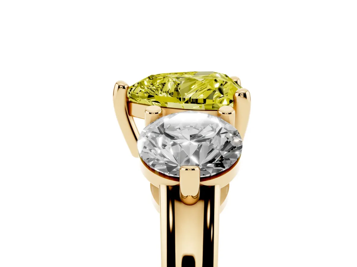 Fancy Yellow Three-Stone Heart Cut Brilliant Cut Solitaire Ring with Prong Setting on a Classic Band Yellow gold